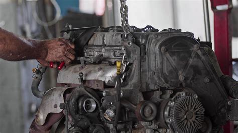 Car Engine Repairs With Tools In Service At Workshop By Craftsmen