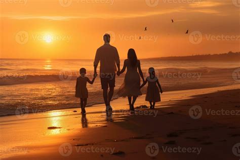 Happy family walking at the beach at sunset 26432367 Stock Photo at ...