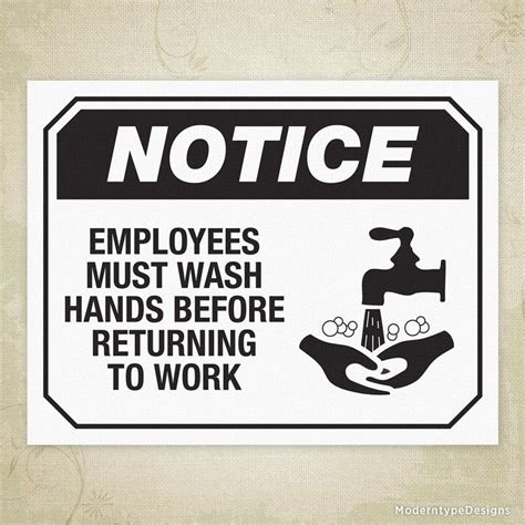 A Sign Stating Employees Must Wash Hands Before Returning To Work