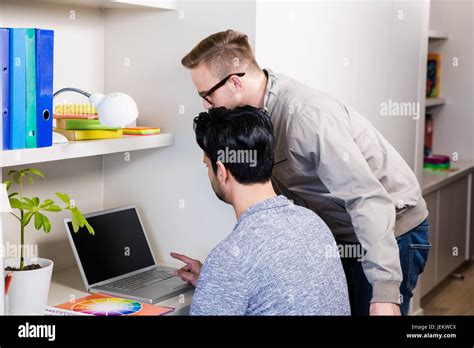 Serious Gay Couple Using Laptop Stock Photo Alamy