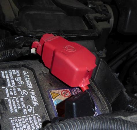 How To Remove The Red Plastic Shroud Over The Positive Battery Terminal