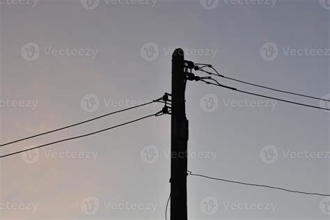 Silhouette electric pole and warm sky. 14165174 Stock Photo at Vecteezy