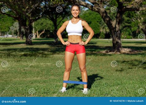 Athletic Woman Workout With Resistance Band Outdoors Fitness Girl