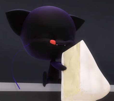 A Black Cat Is Holding Onto A Piece Of Cheese