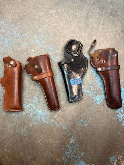 Four leather pistol holsters - The Auction Team