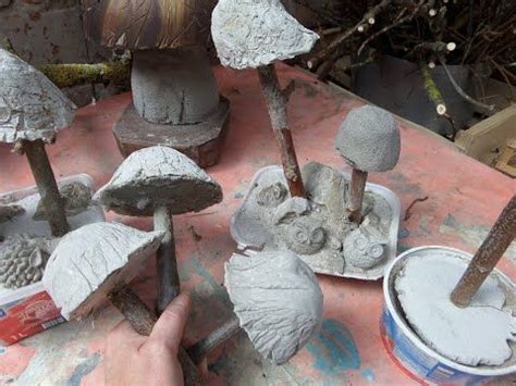 Someone Is Working With Clay To Make Some Mushroom Sculptures In Their