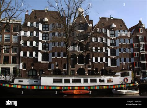 View At Brouwersgracht Canal In Amsterdam With House Boats And Canal