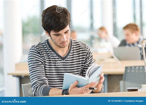 Young Male Student Read Book In Classroom Stock Image Image Of