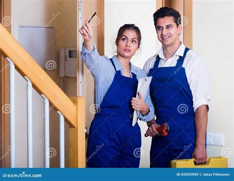 Handyman And Assistant In Uniform Stock Image Image Of Flat American