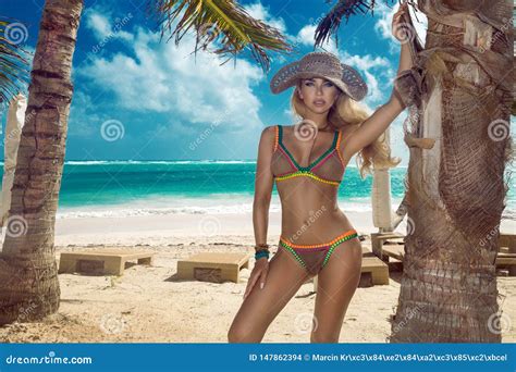 Beautiful Bikini Woman Posing On The Caribbean Beach Stock Photo