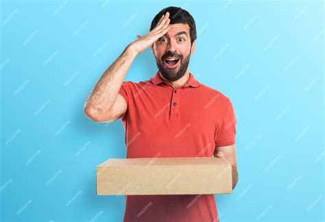 Premium Photo Handsome Man Holding Boxes On Colorful Background