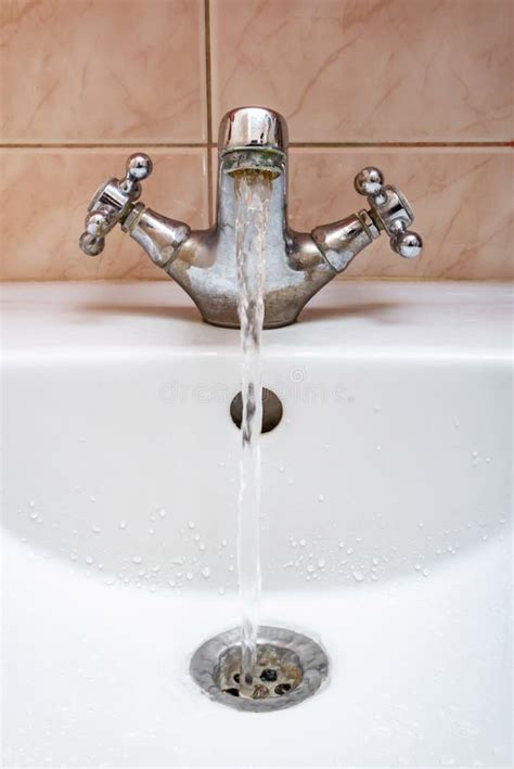 Tap with Water Flowing Strongly Stock Image - Image of abundant, resource: 142126239