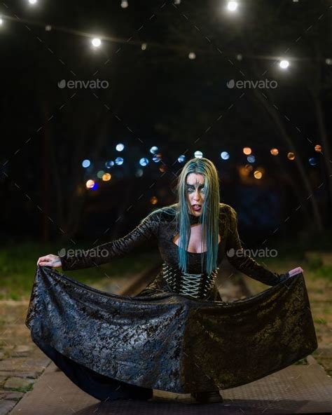 Portrait Of A Hot Woman In A Gothic Costume Posing Outdoors At Night Stock Photo By Wirestock