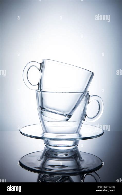 Two Isolated Transparent Tea Cups With Saucers Stock Photo Alamy