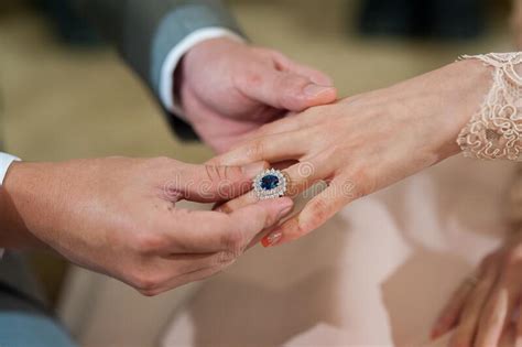 Groom Put A Ring On Finger Of His Lovely Bride Stock Image Image Of