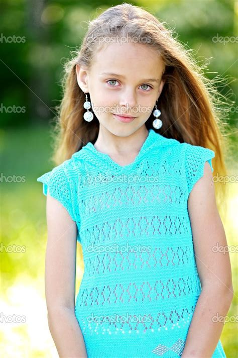 Portrait of little girl outdoors in summer — Stock Photo © zagorodnaya