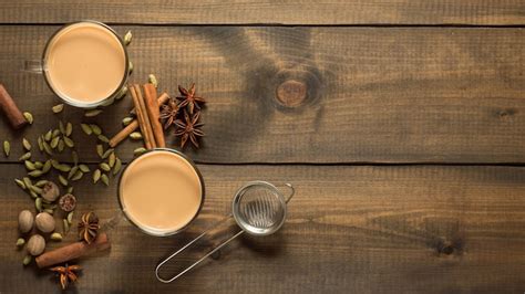 Premium Photo Two Mugs With Masala Tea Stand On A Wooden Table With Spices Top View