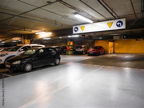 Many Parked Cars In A Parking Garage Of The Shopping Mall Illuminated