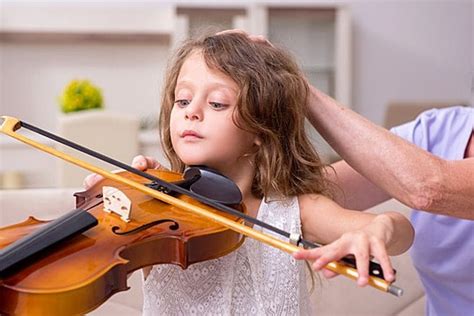 The Old Lady Teaching Little Girl To Play Violin Old Lady Teaching