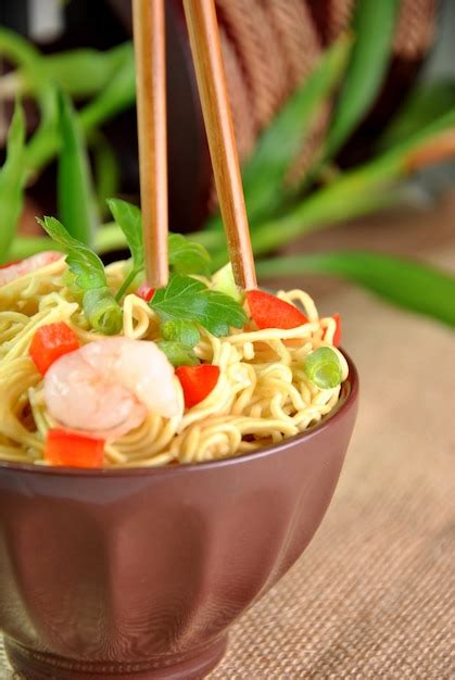 Premium Photo Chinese Noodle Dish With Shrimp And Vegetables