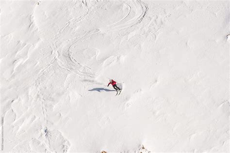 Man Skiing With High Speed Downhill Steep Slope By Stocksy