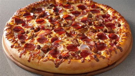 Premium Photo Meat Lovers Pizza Piled High With Pepperoni Sausage