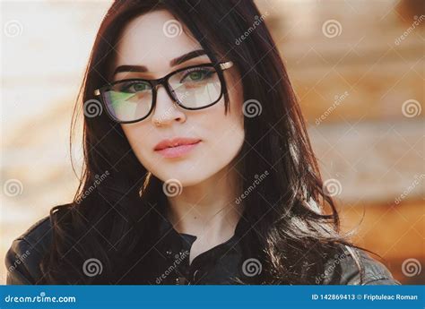 Beautiful Positive Fashionable Stylish Modern Brunette Girl In Trendy Glasses Looking At Camera