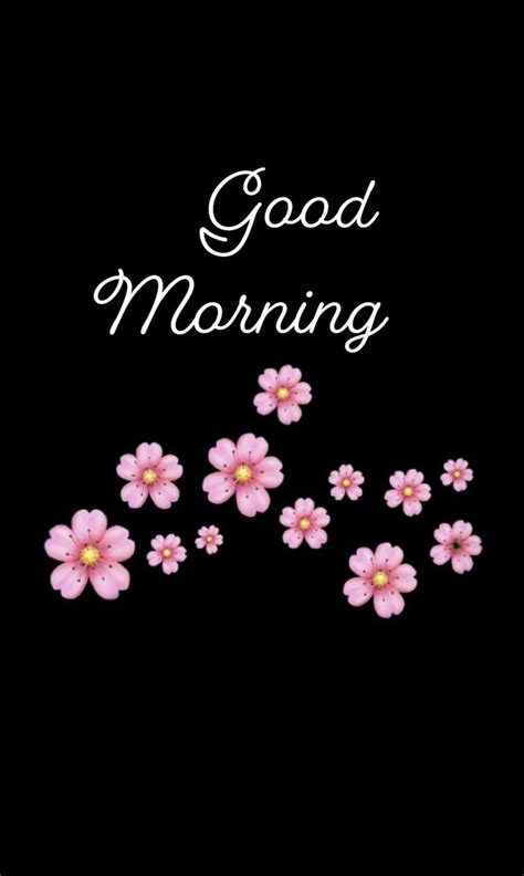 A Black Background With Pink Flowers And The Words Good Morning Written In White On It