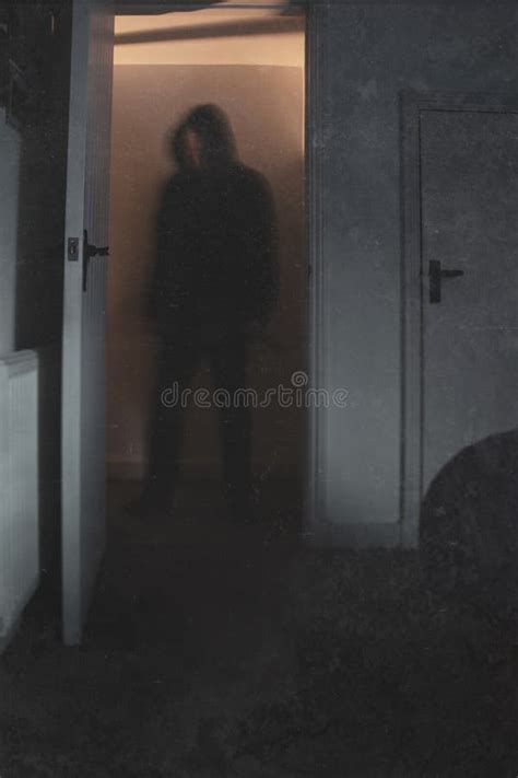 A Halloween Cocept of a Blurred Scary, Hooded Figure, Standing in a ...