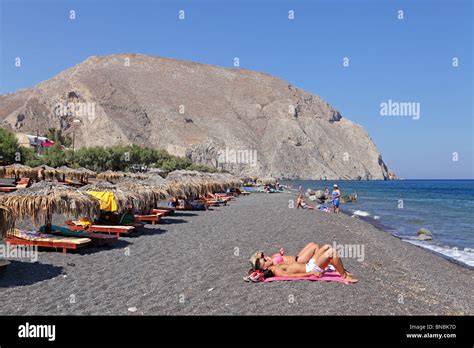 black sandy beach of Perissa, Santorini Island, Cyclades, Aegean Stock ...