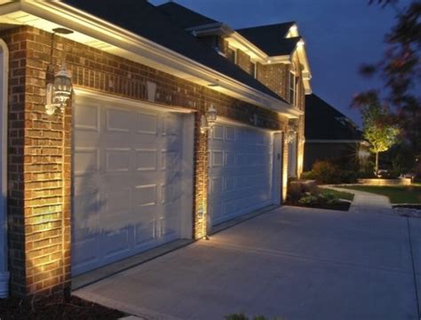 Add curb appeal with lighting around the garage door | Midway Garage Doors