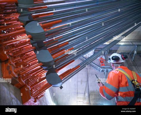 Civil Engineers Inspecting Cable Anchorage In Suspension Bridge The