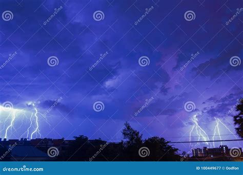 Storm Clouds with Lightning Strike Bolts Passing Over Night City Stock ...