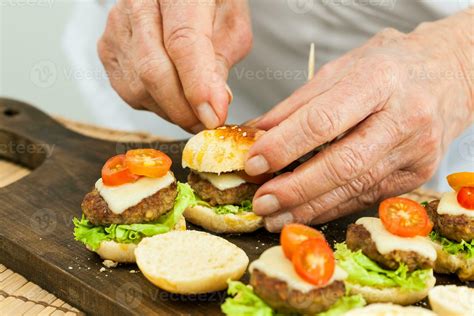 Putting On A Toothpick On Burger Step By Step Preparation Of Mini