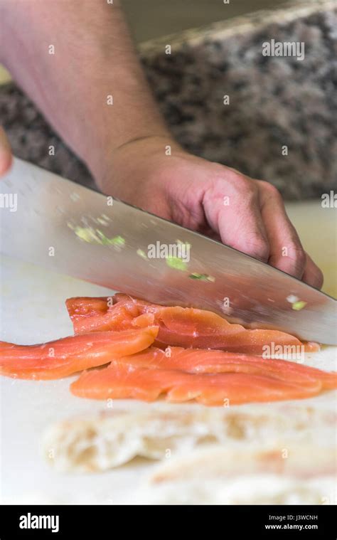 A Chef Cutting Smoked Salmon Knife Kitchen Food Preparation Fish Dish