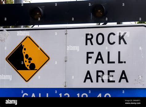 Large Warning Sign With Falling Rocks In Rock Fall Area Danger Of