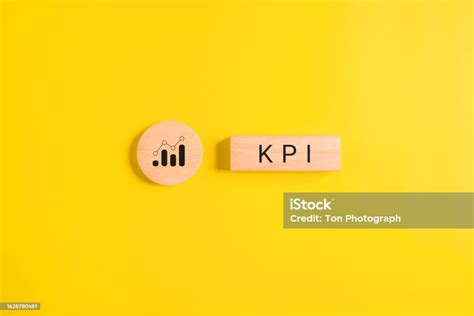 Key Performance Indicator Businessman Holding Wooden Cube With Kpi