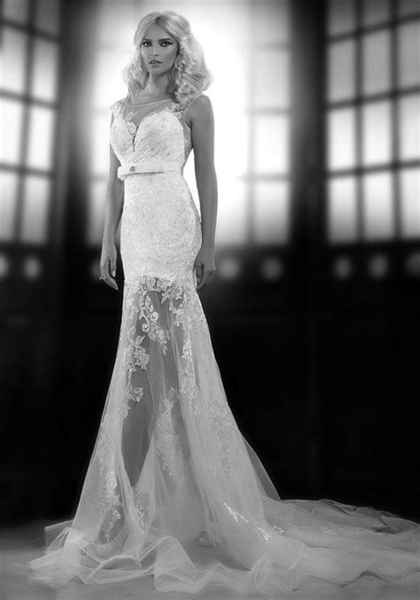 black and white photo of woman in wedding dress with sheer lace ...