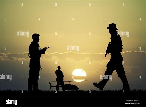 soldiers at sunset Stock Photo - Alamy