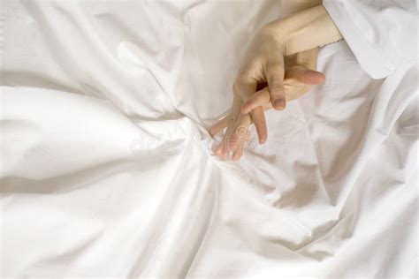 Couple Having Sex Hand Clutches Grasps A White Crumpled Bed Sheet In A Hotel Room A Sign Of