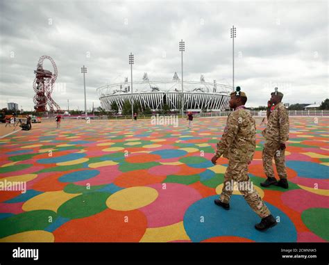 Soldiers From The Royal Scottish Regiment Walk Past The Olympic Stadium