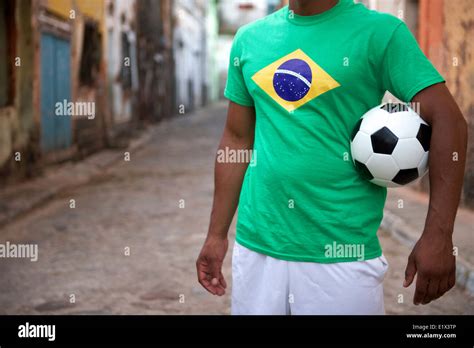 Brazilian street football player standing in Brazil flag t-shirt ...