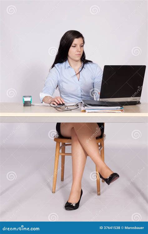 Female Poses Behind A Desk In The Office Stock Photo Image Of