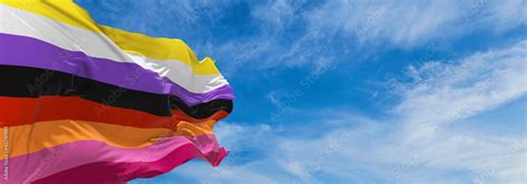 Nonbinary Lesbian Flag Waving In The Wind At Cloudy Sky Freedom And Love Concept Pride Month