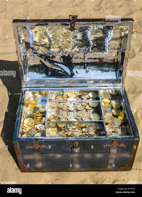 Treasure Chest With Gold And Silver Coins On The Sand Stock Photo Alamy