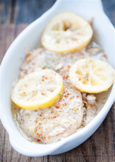 Baked Fish Fillet in Butter and Lemon Sauce Stock Image - Image of lemon, melted: 138343671