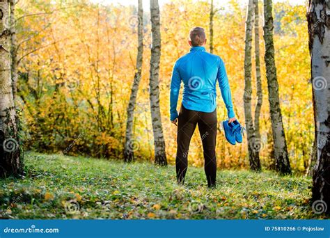 Young Handsome Hipster Runner Outside In Sunny Autumn Nature Stock