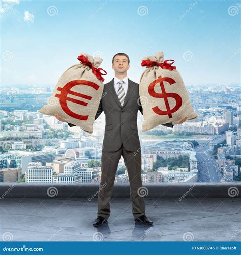 Man Holding Moneybags With Dollar And Euro Signs Stock Photo Image Of