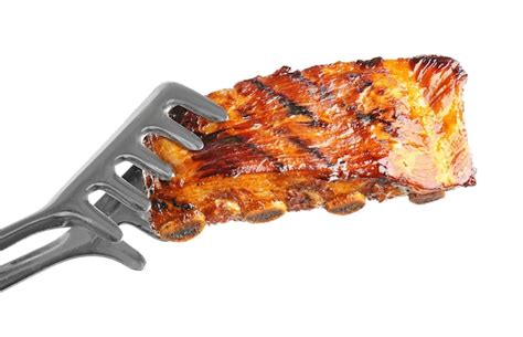 Premium Photo Forceps With Delicious Grilled Ribs On White Background