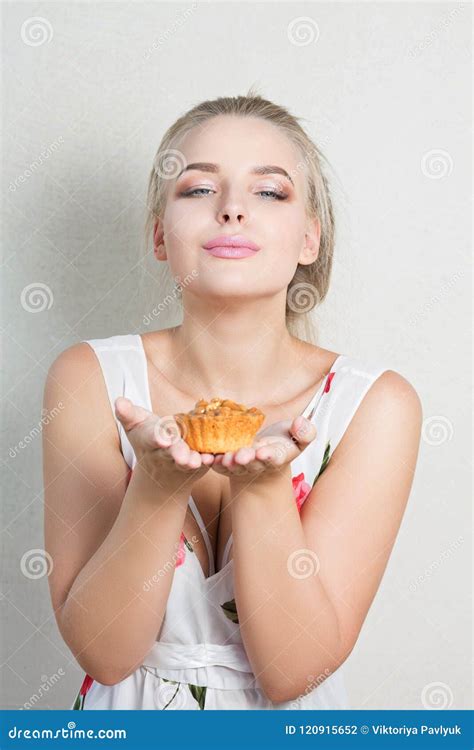 Attractive Blonde Girl Enjoying Palatable Cupcake With Nuts Stock Photo Image Of Cute Cake